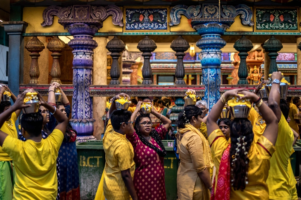 Hindu devotees carry milk pots ahead of the Thaipusam festival at Batu Caves temple in Kuala Lumpur January 21, 2024. ― Picture by Firdaus Latif
