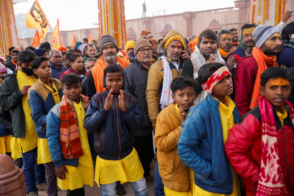 Hindu devotees stand in a queue as they wait to enter the Hindu god Lord Ram temple after its inauguration in Ayodhya, India, January 23, 2024. — Reuters pic
