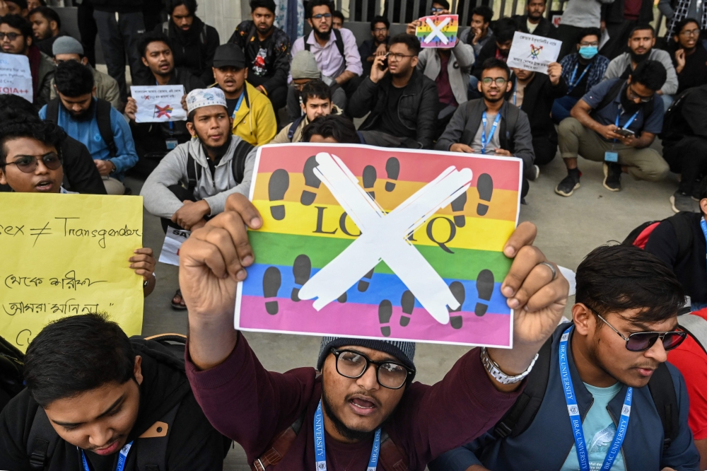 Students of BRAC University shout slogans as they stage a protest against LGBTQ community in Dhaka on January 23, 2024. Hundreds of students from a top Bangladesh university demanded the reinstatement on January 23 of a lecturer sacked for publicly condemning the inclusion of transgender content in the national school curriculum. — AFP pic