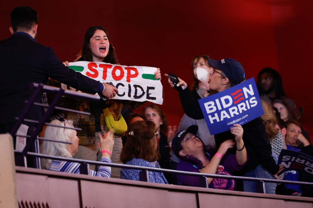 As Joe Biden attacked Donald Trump over the key election issue of abortion rights, pro-Palestinian hecklers carried out their most disruptive protest yet against the US president as he spoke. — Reuters pic