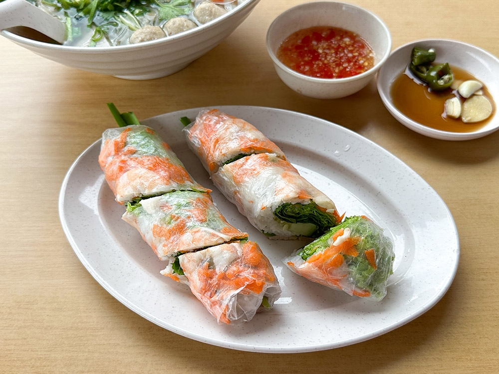 Pair the noodles with plump Vietnamese fresh spring rolls filled with noodles, vegetables, prawns and sliced pork.