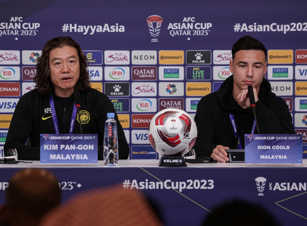 National head coach Kim Pan Gon and Harimau Malaya centre-back Dion Cools during a press conference in Doha, January 24, 2024. — Bernama pic 