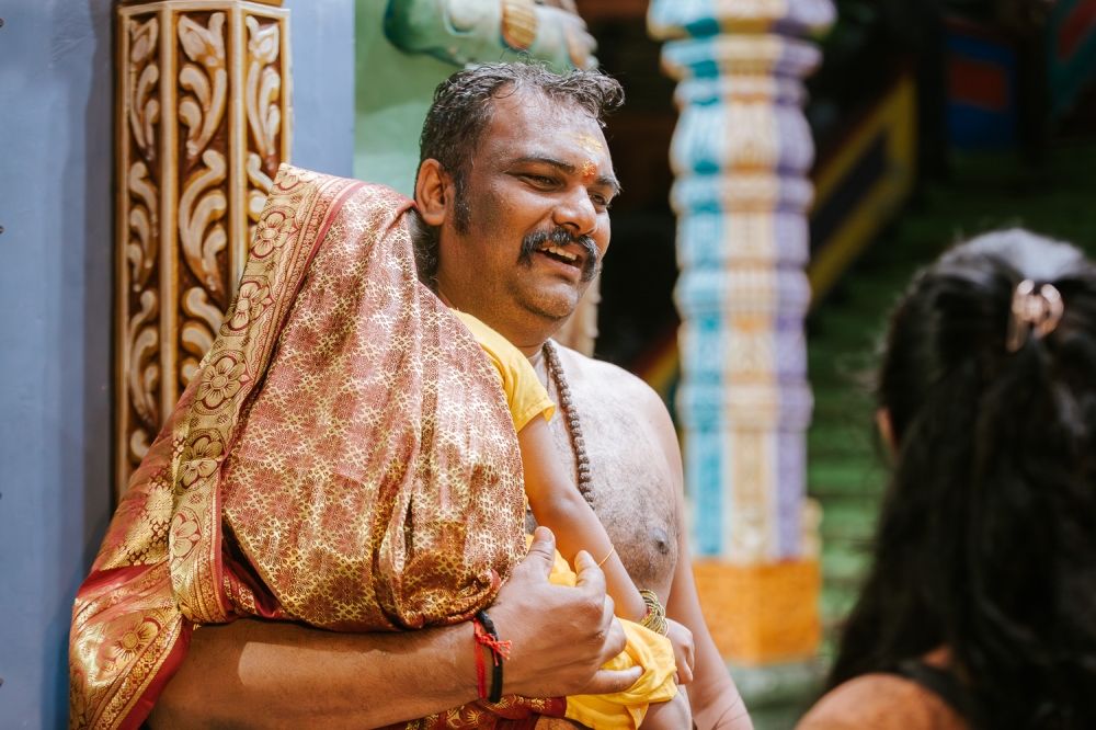Bala Murugan, 39, who was accompanied by his wife, Uma, 36 and their two kids were among the worshippers who chose to carry the kavadi two days earlier to ensure peaceful and unhurried vows. — Picture by Raymond Manuel