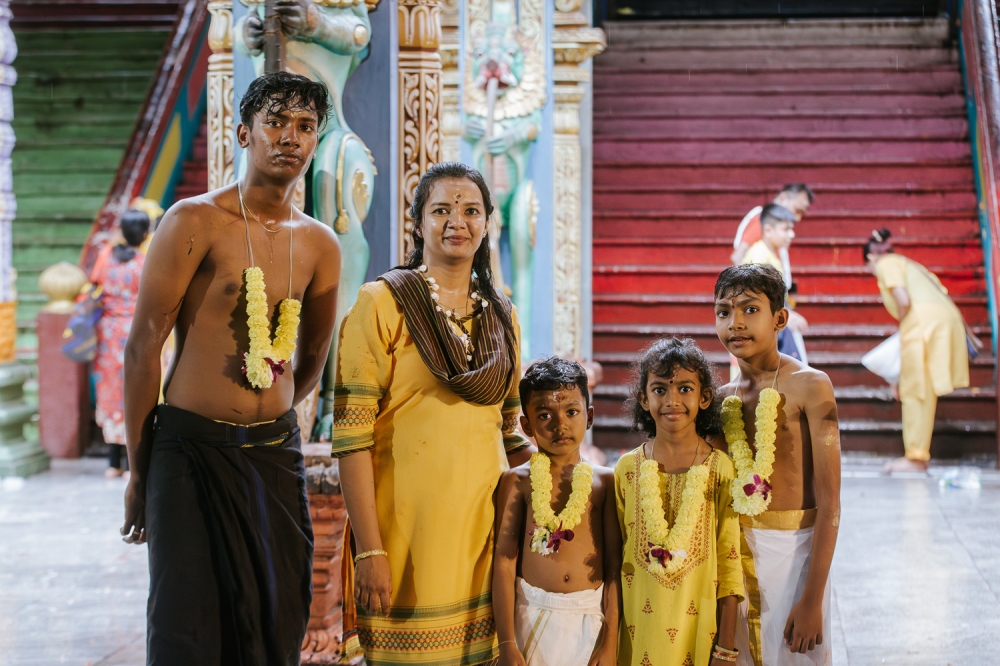 Anbukarasi, 39 from Batang Kali, fulfils her vows  with her four children ahead of Thaipusam at Batu Caves, January 23, 2024. — Picture by Raymond Manuel