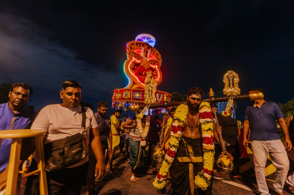 Devotees carrying the kavadi in conjunction with Thaipusam at Batu Caves temple. — Picture by Raymond Manuel