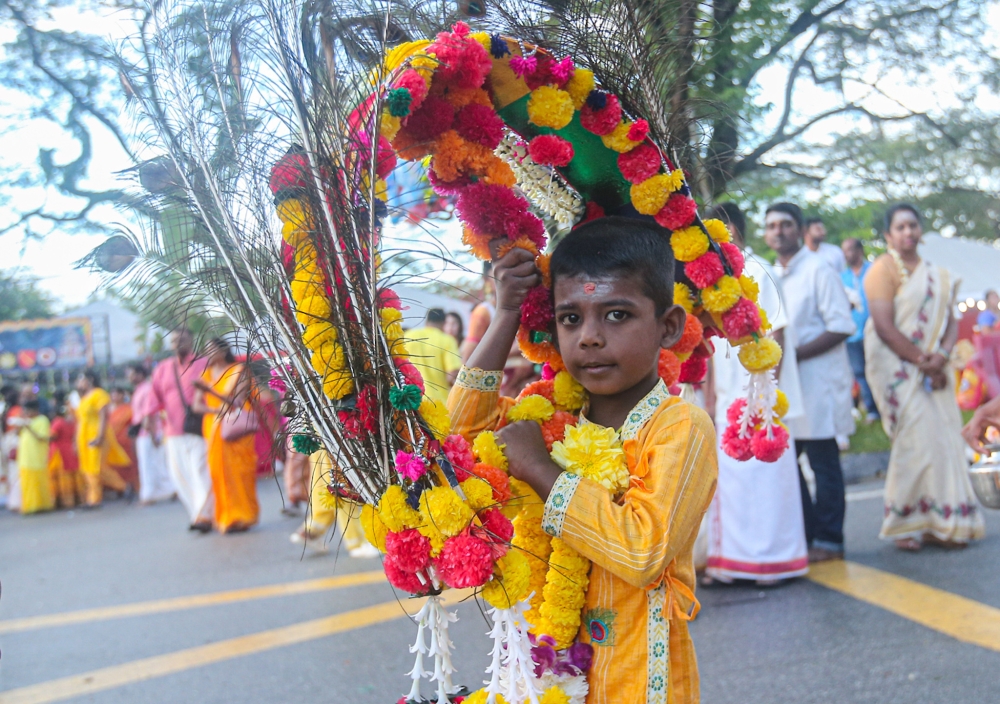 A little boy celebrates Thaipusam at the Kallumalai Arulmigu Subramaniar Temple in Gunung Cheroh, Ipoh. — Picture by Farhan Najib