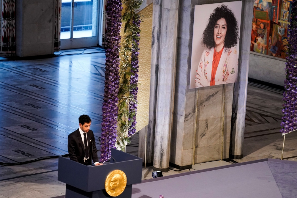 Ali Rahmani, son of Narges Mohammadi, an imprisoned Iranian human rights activist, who was awarded the Nobel Peace Prize 2023, speaks after receiving the award on behalf of his mother at Oslo City Hall, Norway December 10, 2023. — NTB/Fredrik Varfjell via Reuters