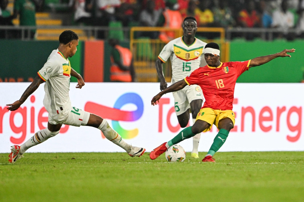 Senegal’s defender Ismail Jakobs (left) fights for the ball with Guinea’s midfielder Aguibou Camara during the Africa Cup of Nations (CAN) 2024 group C football match between Guinea and Senegal at Stade Charles Konan Banny in Yamoussoukro on January 23, 2024. — AFP pic 