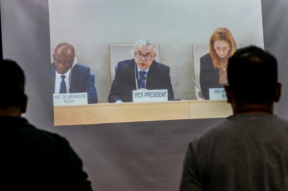 A screen shows UN Human Rights Council vice president Marcelo Eliseo Scappini (centre) chairing Malaysia’s session for the fourth Universal Periodic Review cycle in Geneva, Switzerland, on January 25, 2024. ― Picture by Hari Anggara
