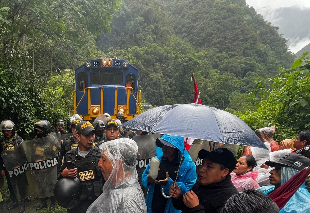 Visitors to Peru’s iconic Machu Picchu site had their trip briefly interrupted yesterday by protesters angry with the government for privatising ticket sales at the Inca citadel. — AFP pic