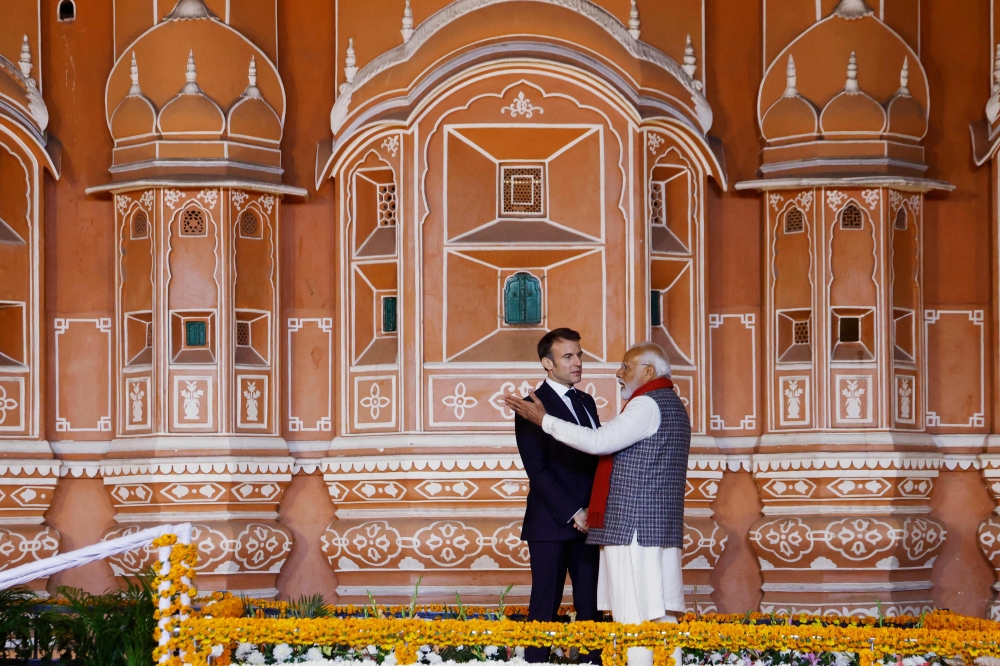 Prime Minister Narendra Modi and President Emmanuel Macron during their visit to the Hawa Mahal, also known as the Palace of the Winds, in Jaipur. — AFP pic