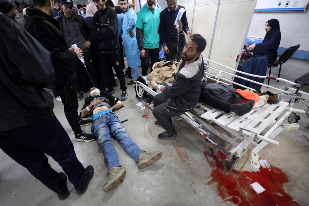The injured receiving treatment at the Al-Shifa hospital following an Israel bombing that was said to have killed at least 20 people as they were waiting for humanitarian aid to be distributed. — AFP pic