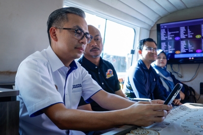 Fahmi takes boat ride along Sungai Melaka to test quality of cellular coverage