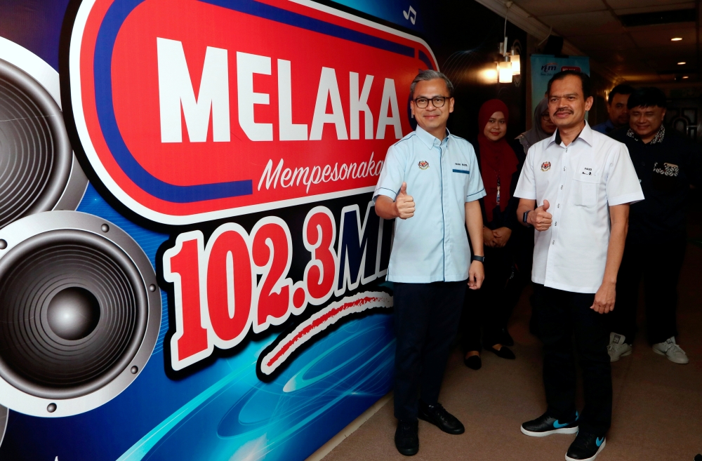 Minister of Communications Fahmi Fadzil (left) there is merit in the proposal considering the boom in the gig economy, such as food delivery services. ― Bernama pic