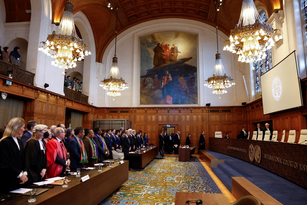 Officials stand on the day the International Court of Justice (ICJ) rule on emergency measures against Israel following accusations by South Africa that the Israeli military operation in Gaza is a state-led genocide, in The Hague, Netherlands January 26, 2024. — Reuters pic