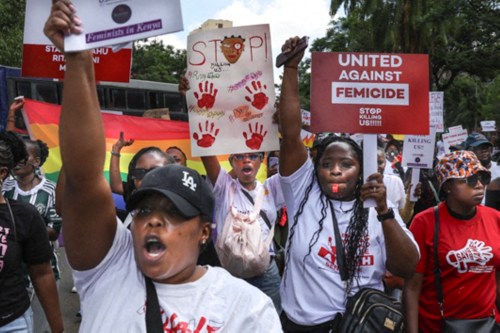 Activists march as they demonstrate in the Central Business District against an alarming rise in murders of young women in Nairobi on January 27, 2024. — AFP pic