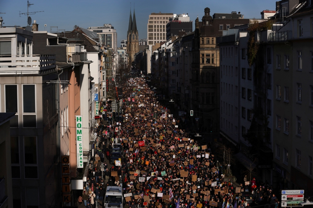 People attend a demonstration against the Alternative for Germany party (AfD), right-wing extremism and for the protection of democracy in Duesseldorf, Germany, January 27, 2024. — Reuters pic