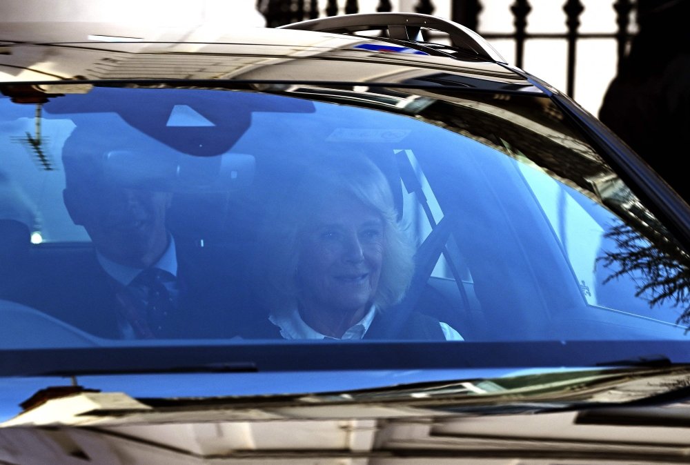 Britain’s Queen Camilla is driven away from the London Clinic in London on January 27, 2024 after visiting her husband King Charles III. Britain's King Charles III spent a second day in hospital on Saturday where he was visited by his wife Queen Camilla following scheduled prostate surgery. — AFP pic