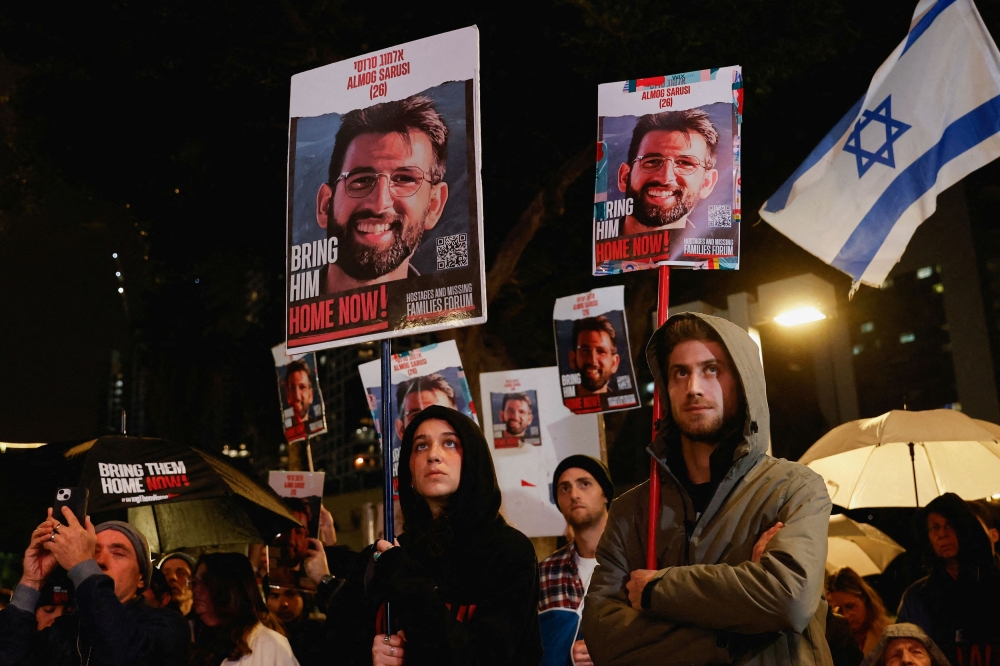 Demonstrators attend a rally calling for the release of hostages kidnapped in the October 7 attack on Israel by Hamas. — Reuters pic