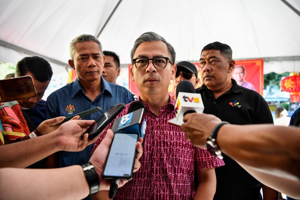 Unity Government spokesman Fahmi Fadzil speaks to the media after presenting Chinese New Year contributions to the Chinese community in Taman Sri Sentosa in the Lembah Pantai parliamentary constituency, January 28, 2024. — Bernama pic