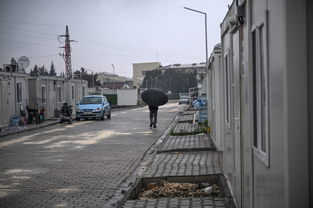 Antakya’s survivors have been left to deal with the shock in fenced-off camps comprised of hundreds of identical homes that look like shipping containers. — AFP pic