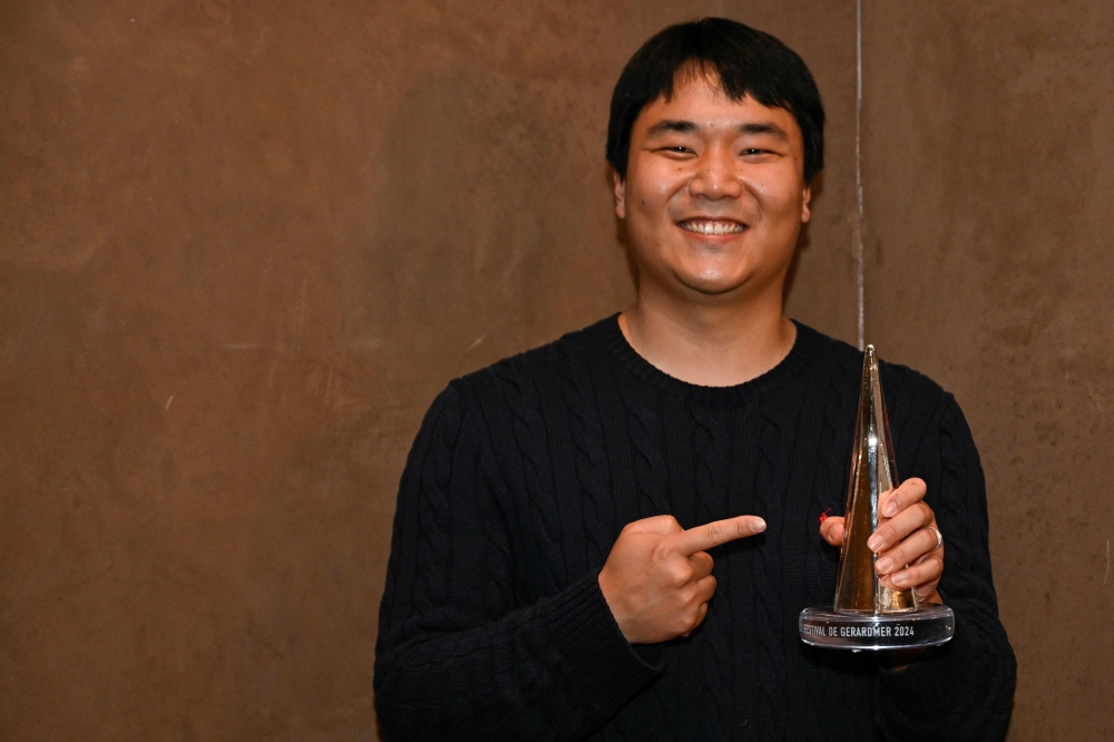 South Korean director Jason Yu poses after winning the Grand prize for the film 'Sleep' during the closing ceremony of the 31st Gerardmer Fantastic Film Festival in Gerardmer, northeastern France, on January 28, 2024. — AFP pic