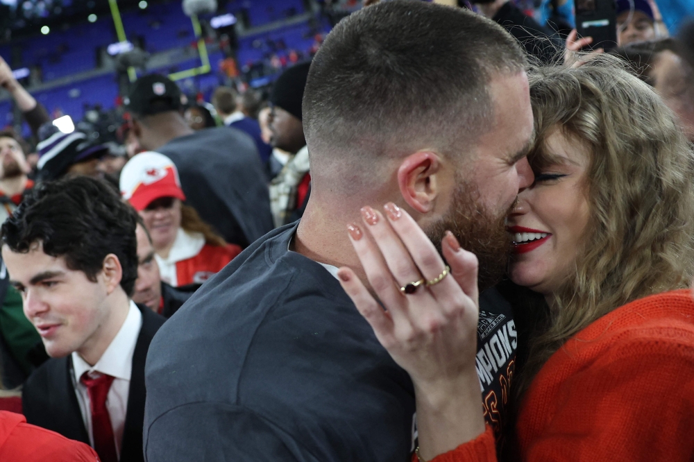 Travis Kelce #87 of the Kansas City Chiefs embraces Taylor Swift after a 17-10 victory against the Baltimore Ravens in the AFC Championship Game at M&T Bank Stadium on January 28, 2024 in Baltimore, Maryland. — Patrick Smith/Getty Images/AFP pic