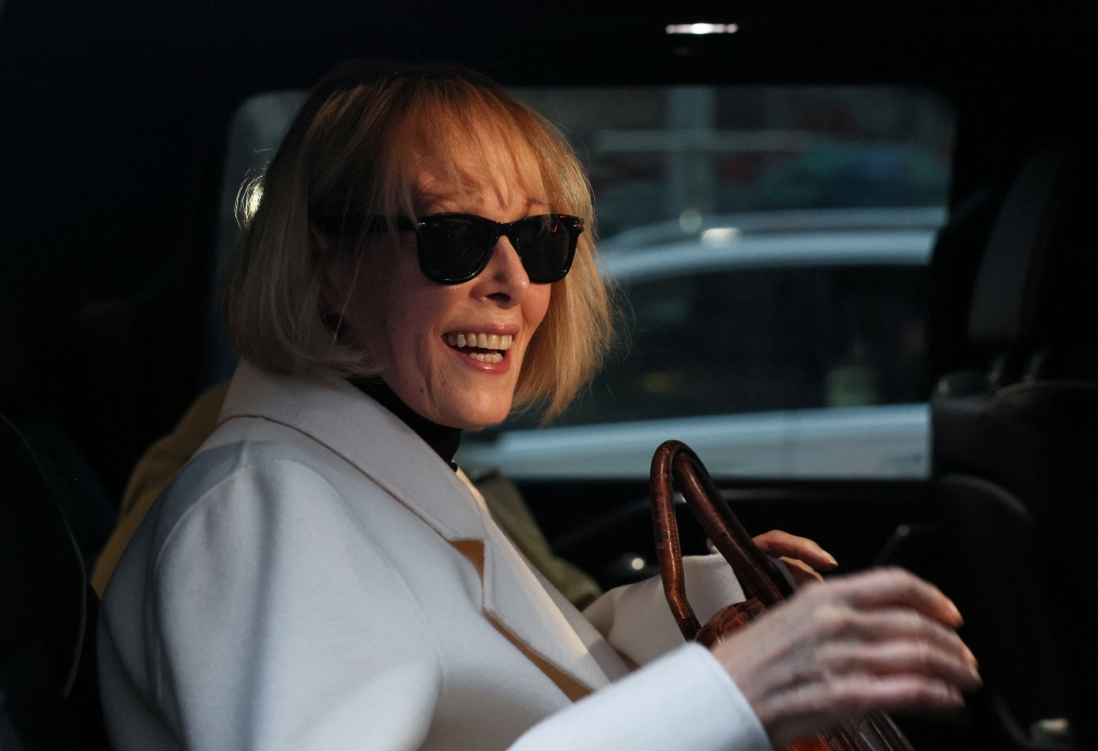 E. Jean Carroll reacts in a car outside the Manhattan Federal Court, after the verdict in the second civil trial was reached after she accused former US president Donald Trump of raping her decades ago, in New York January 26, 2024. ― Reuters pic 