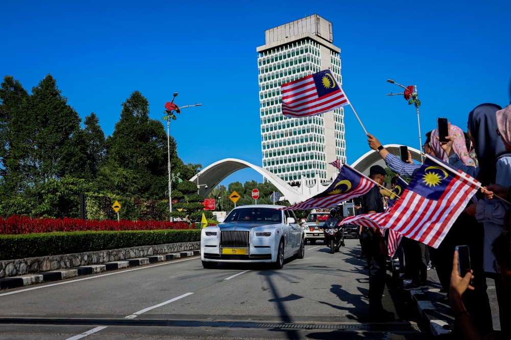 Yang di-Pertuan Agong Al-Sultan Abdullah Ri’ayatuddin Al-Mustafa Billah Shah and Raja Permaisuri Agong Tunku Azizah Aminah Maimunah Iskandariah depart from the Parliament Square in Kuala Lumpur January 30, 2024. — Bernama pic