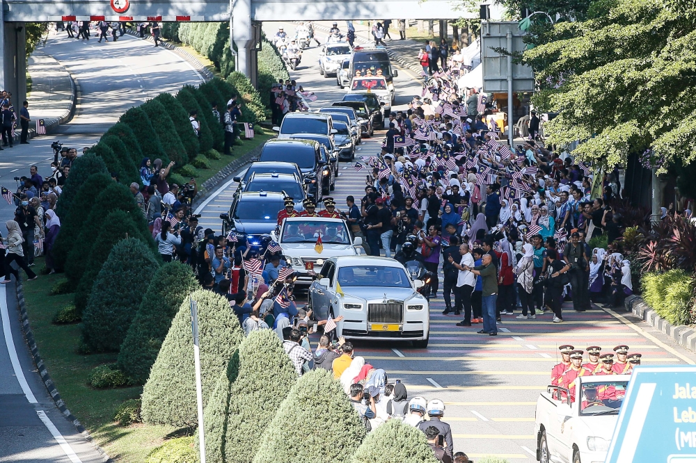 The Royal vehicle carrying Yang di-Pertuan Agong Al-Sultan Abdullah Ri'ayatuddin Al-Mustafa Billah Shah and Raja Permaisuri Agong Tunku Azizah Aminah Maimunah Iskandariah passing well-wisher along Jalan Dato Onn earlier today during the sending-off ceremony in Kuala Lumpur January 30, 2024. —  Picture by Sayuti Zainudin
