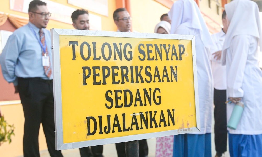 Students of SMK Raja Perempuan waiting to enter the school hall to sit for their Sijil Pelajaran Malaysia (SPM) examination, in Ipoh January 30, 2024. —Picture by Farhan Najib