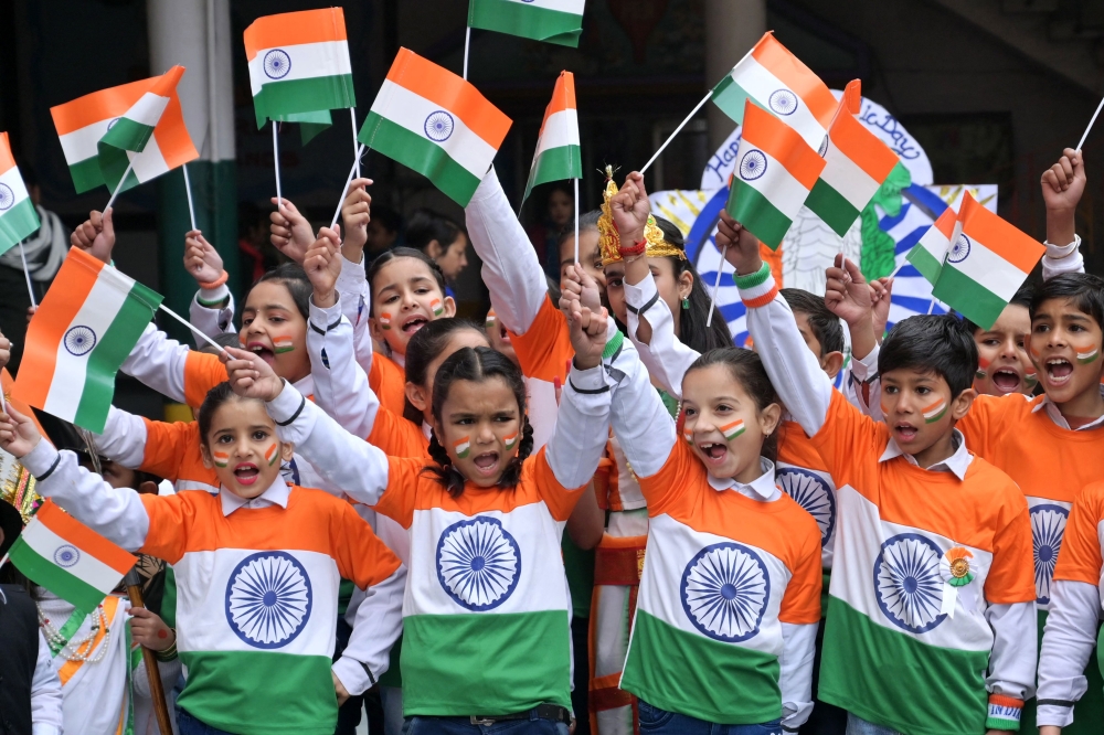 Children wearing outfits with India's national flag colours cheer during celebrations on the eve of the country's Republic Day, at a school in Amritsar January 25, 2024. The Malaysian High Commissioner to India Datuk Muzafar Shah Mustafa said Malaysia is actively working to attract more Indian students as part of its initiative to promote its universities globally. — AFP pic 