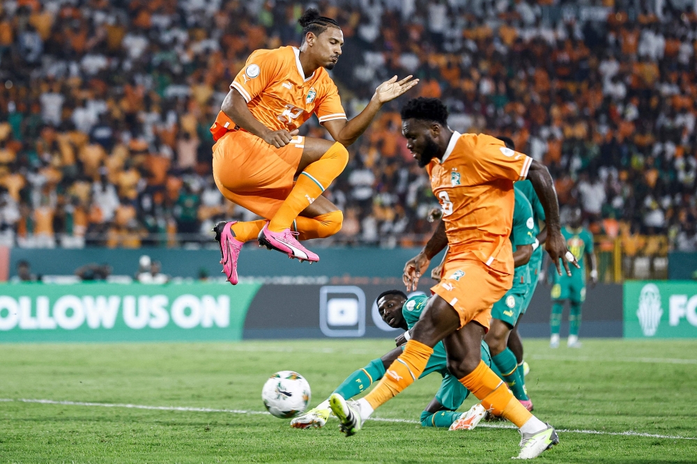 Ivory Coast’s forward Sebastien Haller jumps next to Ivory Coast’s midfielder Franck Kessie during the Africa Cup of Nations (CAN) 2024 round of 16 football match between Senegal and Ivory Coast at the Stade Charles Konan Banny in Yamoussoukro on January 29, 2024. — AFP pic 