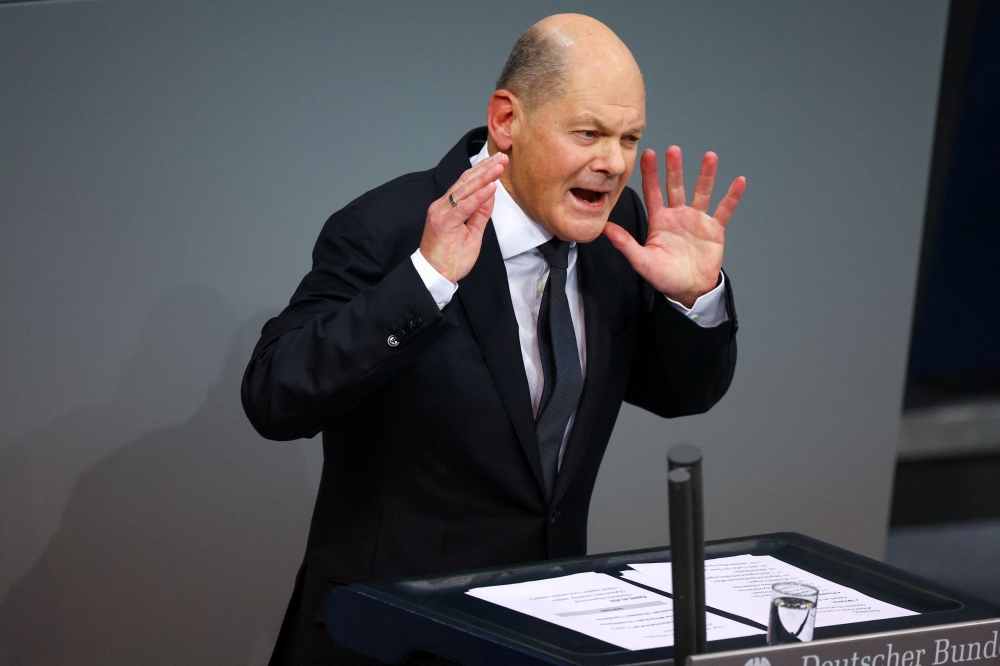 Addressing the Bundestag lower house of parliament after a special session marking the Holocaust and dressed in a black suit and tie, German Chancellor Olaf Scholz said democrats must stand together and stop the shift to the right.