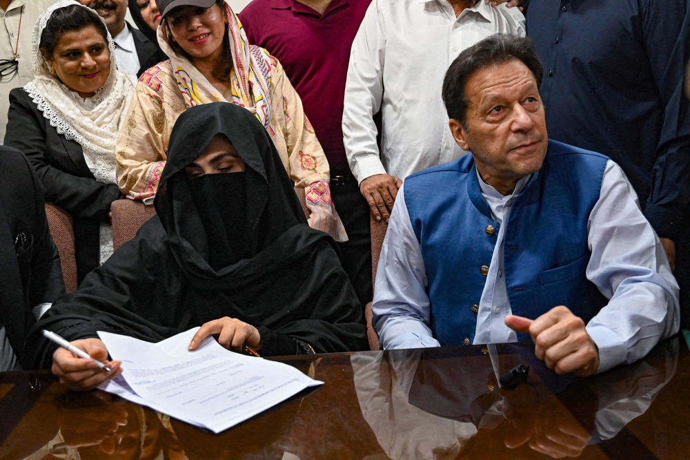 The wife of former Pakistan prime minister Imran Khan — jailed alongside her husband yesterday for 14 years for graft — is serving her sentence at home after their residence was officially declared a ‘sub-jail’ by authorities. — AFP pic