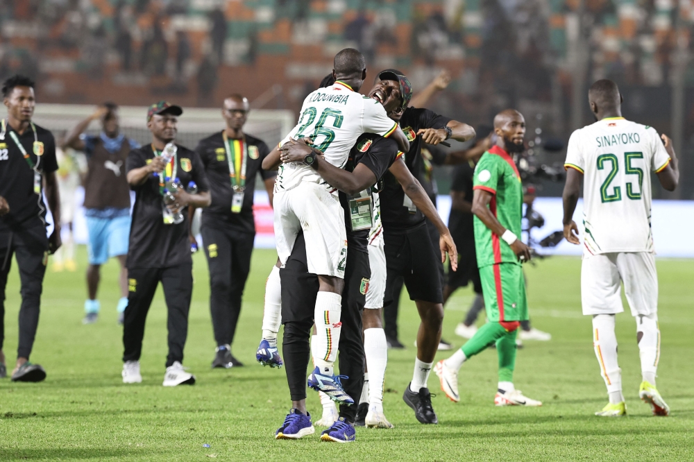 Mali's midfielder #26 Kamory Doumbia (centre) celebrates after the victory at the end of the Africa Cup of Nations (CAN) 2024 round of 16 football match between Mali and Burkina Faso at the Amadou Gon Coulibaly Stadium in Korhogo January 30, 2024. — AFP pic