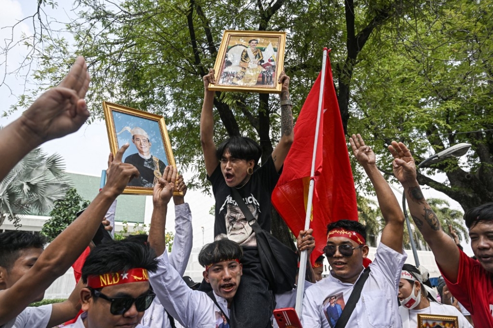 Protesters hold an image of detained civilian leader Aung San Suu Kyi during a demonstration outside the UN office in Bangkok on February 1, 2024, to mark the third anniversary of the coup in Myanmar. — AFP pic