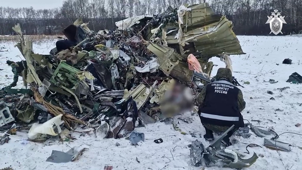 In this screen grab taken from a handout footage released by the Russian Investigative Committee on January 25, 2024, an investigator works at the Russian IL-76 military transport plane crash site in the Belgorod region. — AFP pic/Russian Investigative Committee