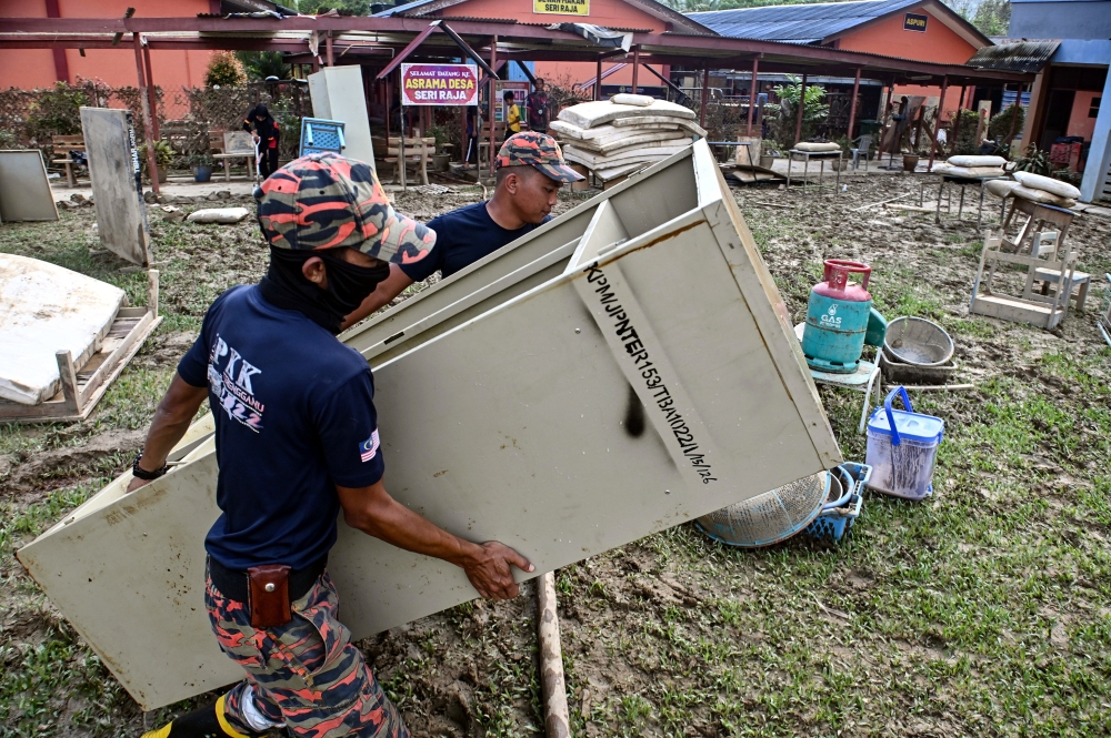 Fire and Rescue Department personnel clear the area affected by the recent mud flood at Sekolah Kebangsaan Pasir Raja, Dungun, February 1, 2024. — Bernama pic 