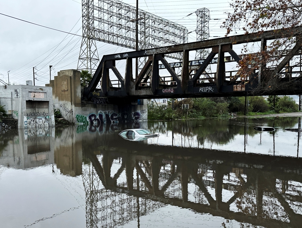 Cars lie partially submerged in Long Beach, California. — Reuters pic