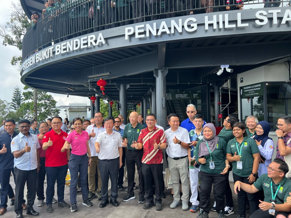 Penang chief minister Chow Kon Yeow (fourth from left) at the reopening of the Penang Hill Station. — Picture by Opalyn Mok