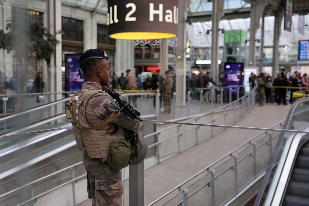 A French soldier of the Sentinelle security operation stands guard in a hall after a knife attack at Paris’s Gare de Lyon railway station, a major travel hub, on February 3, 2024. — AFP pic