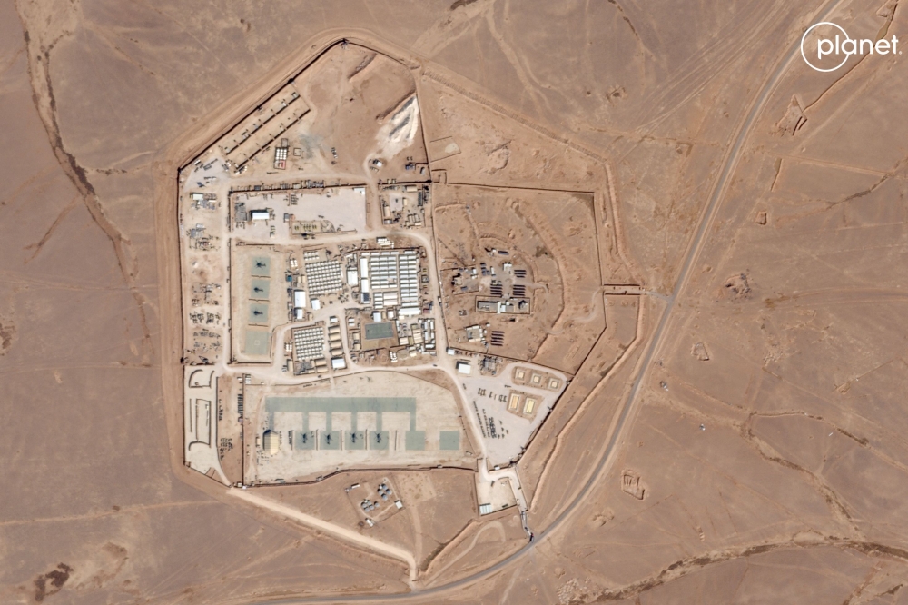 This handout satellite picture released on January 29, 2024 by Planet Labs PBC and captured on October 12, 2023 shows a view of the base, known as Tower 22, which is operated by US troops as part of an international coalition against the Islamic State (IS)  jihadist group, near Jordan's border with Iraq and Syria in the north-eastern Rwaished District. — AFP pic