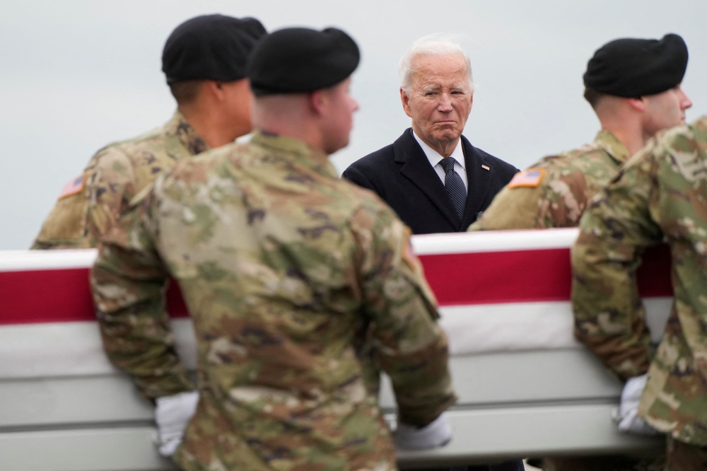 US President Joe Biden attends the dignified transfer of the remains of Army Reserve Sergeants William Rivers, Kennedy Sanders and Breonna Moffett, three US service members who were killed in Jordan during a drone attack carried out by Iran-backed militants, at Dover Air Force Base in Dover, Delaware, US, February 3, 2024. — Reuters pic