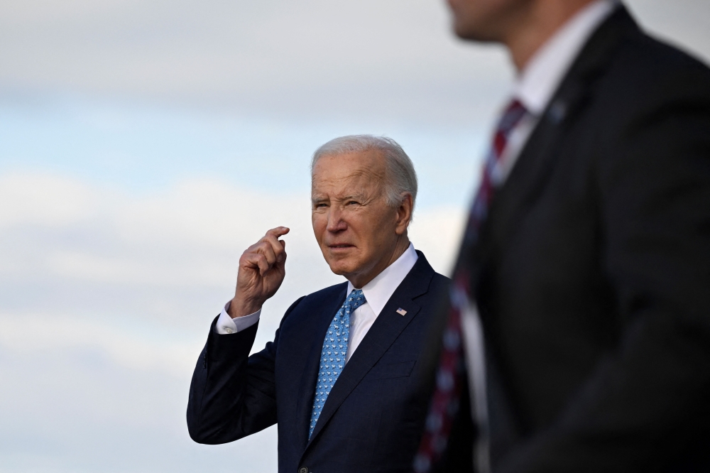US President Joe Biden steps off Air Force One upon arrival at Miami International Airport in Miami, Florida, on January 30, 2024. Biden is in Florida to speak at campaign receptions. — AFP pic