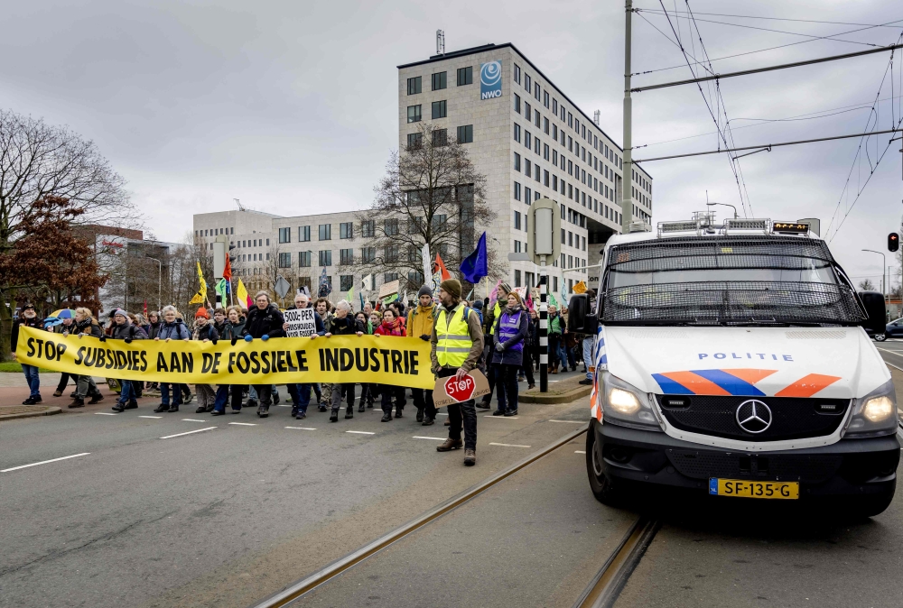 The Dutch police said yesterday that they arrested 1,000 people at a civil disobedience action by the environmental group Extinction Rebellion to protest the country’s fossil fuel subsidies. — AFP pic