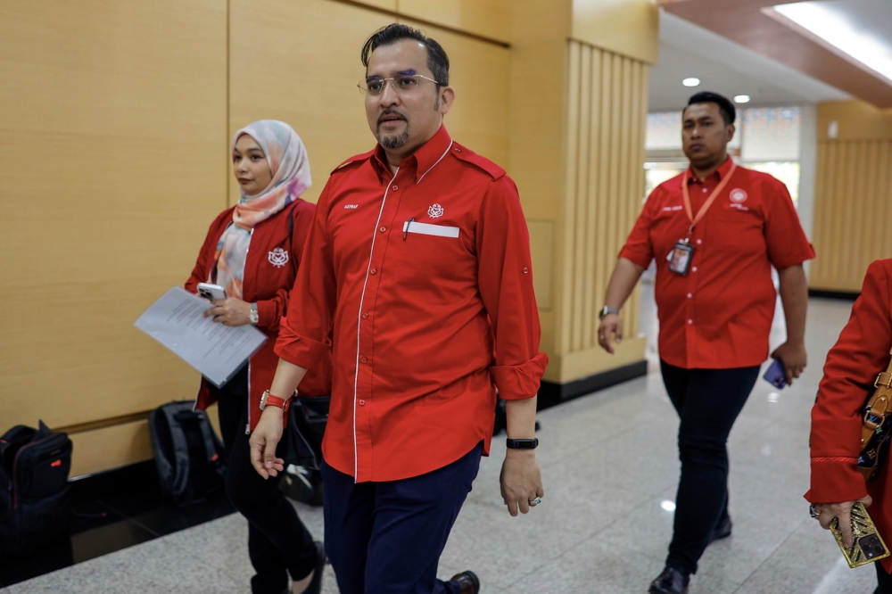 Umno Secretary General Datuk Dr Asyraf Wajdi Dusuki (second left) arriving to attend the closed meeting of the Umno President with Umno Division Heads at the Kuala Lumpur World Trade Center (WTC-KL) February 4, 2024. — Bernama pic