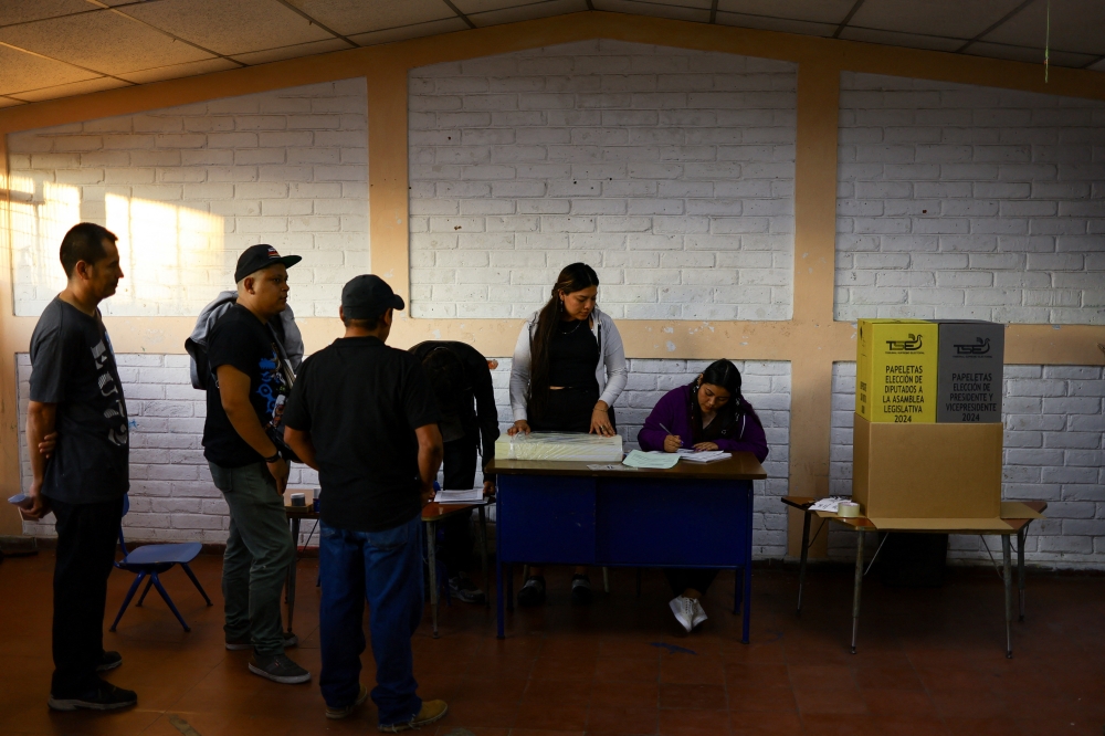 Members of the vote receiving board work at a voting center on the day of the presidential elections in San Salvador, El Salvador February 4, 2024. — Reuters pic