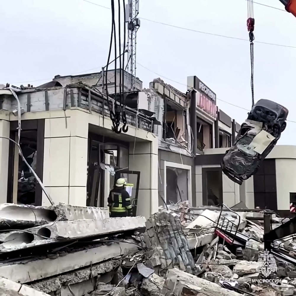 This grab from a handout footage released by the Russian Emergencies Ministry on February 3, 2024 shows rescuers clearing rubble of a destroyed bakehouse hit by recent shelling in the town of Lysychansk. — Handout / Russian Emergencies Ministry / AFP pic