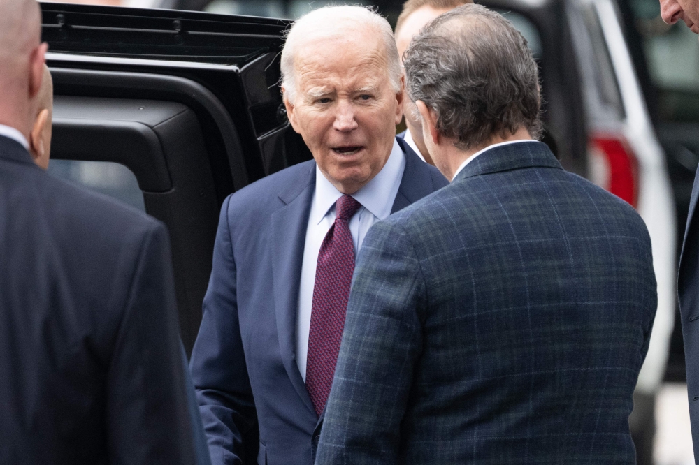 US President Joe Biden (C) and his son Hunter Biden leave The Ivy restaurant in Los Angeles, California, February 4, 2024. US President Joe Biden set his sights yesterday on the Nevada primary. — AFP pic